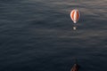 Hot air balloon flying over the ocean, 3d rendering Royalty Free Stock Photo