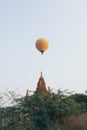 Hot air balloon flying over the pagoda at Bagan temple complex in Myanmar Royalty Free Stock Photo