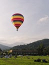 Hot air balloon flying over people