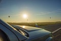 Hot air balloon flying over the road Royalty Free Stock Photo