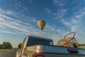 Hot air balloon flying over the road Royalty Free Stock Photo