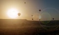 Hot air balloon flying over rock landscape at Cappadocia Turkey Royalty Free Stock Photo