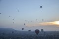 Hot air balloon flying over rocks and valley landscape at Cappadocia near Goreme Turkey Royalty Free Stock Photo