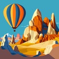 Hot air balloon flying over sandstone desert landscape. Turkey, Cappadocia. Royalty Free Stock Photo