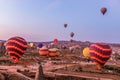 Hot air balloon flying over spectacular Cappadocia, Tourists enjoy the overwhelming views over Cappadocia, Turkey Royalty Free Stock Photo