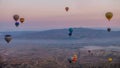 Hot air balloon flying over spectacular Cappadocia, Tourists enjoy the overwhelming views over Cappadocia, Turkey Royalty Free Stock Photo