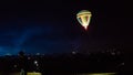 Hot air balloon flying over spectacular Cappadocia under the sky with milky way and shininng star at night with grain Royalty Free Stock Photo