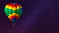 Hot air balloon flying over spectacular under the sky with and shininng star at night Royalty Free Stock Photo