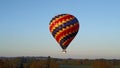 Hot air balloon flying in the rural area