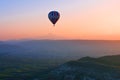Hot air balloon flying at sunrise, Cappadocia, Turkey