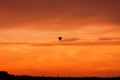 Hot air balloon flying at sunset sky Royalty Free Stock Photo