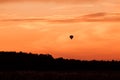 Hot air balloon flying at sunset sky Royalty Free Stock Photo