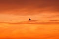 Hot air balloon flying at sunset sky Royalty Free Stock Photo