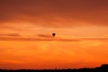 Hot air balloon flying at sunset sky Royalty Free Stock Photo