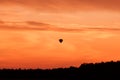 Hot air balloon flying at sunset sky Royalty Free Stock Photo