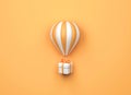 Hot air balloon with gift box on orange background. 3d rendering Royalty Free Stock Photo