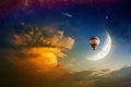 Hot air balloon in glowing sky with rising moon Royalty Free Stock Photo