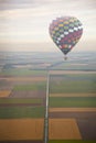 Hot air balloon with green Dutch landscape