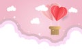 Hot air balloon heart in a cloudy pink sky Royalty Free Stock Photo