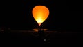 Hot air balloon illuminated by the gas flame in the night Royalty Free Stock Photo