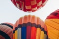 Group of vivid envelope of hot air balloons before floating as seen from below.