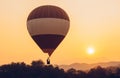 Hot air balloon floating on the sky with beautiful sunset. Conceptual of travel and journey.