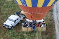 A hot air balloon loaded with Asian tourists lands in a paddock near Goreme in Turkey.