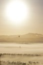 Hot air balloon in misty mountains