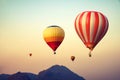 Hot air balloon over mountain on sky sunset