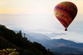 Hot air balloon over mountain in sunrise. Travel concept. Royalty Free Stock Photo