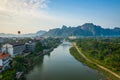 Hot air balloon over Nam Song river at sunrise in Vang vieng, Laos. Asia Royalty Free Stock Photo