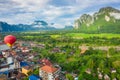 Hot air balloon over Nam Song river at sunrise in Vang vieng, Laos. Asia Royalty Free Stock Photo