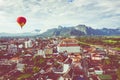 Hot air balloon over Nam Song river at sunrise in Vang vieng, Laos. Asia Royalty Free Stock Photo