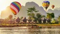 Hot air balloon over Nam Song river at sunset in Vang vieng, Laos Royalty Free Stock Photo