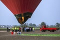 A hot air balloon prepares for lift-off at sunrise at Luxor in Egypt.