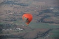 Hot Air Balloon rising high over landscape