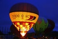 Hot air balloon starting to fly in evening sky