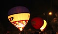 Hot air balloon starting to fly in evening sky