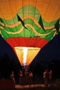 Hot air balloon starting to fly in evening sky