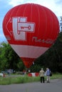 Hot air balloon starting to fly in evening sky Royalty Free Stock Photo