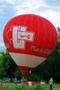 Hot air balloon starting to fly in evening sky