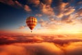 Hot air balloon in the sunset evening sky with clouds