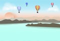 Hot air balloon travel in blue sky over the lake and mountain