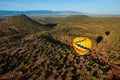 Hot air ballooning over sedona Arizona showing balloon and butte Royalty Free Stock Photo