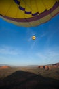 Hot air ballooning over sedona Arizona showing balloon and butte Royalty Free Stock Photo