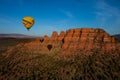 Hot air ballooning over sedona Arizona showing balloon and butte Royalty Free Stock Photo