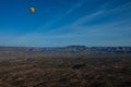 Hot air ballooning over sedona Arizona showing balloon and butte Royalty Free Stock Photo