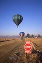 Hot Air Balloons Cross Runway Royalty Free Stock Photo