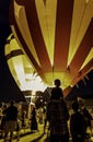 Hot air balloons filling with hot air at night Royalty Free Stock Photo
