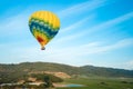 Hot Air Balloons Floating Above Vineyards